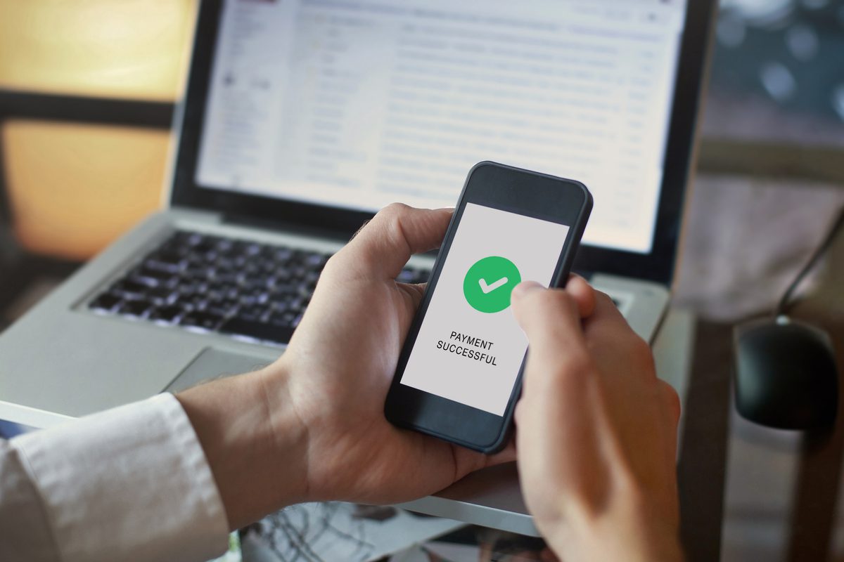 Person on a cell phone enrolling in Paperless billing