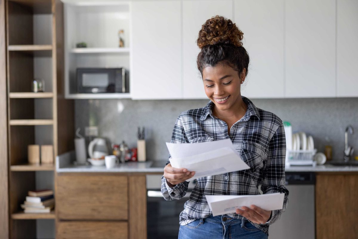 Woman is reviewing a paper bill