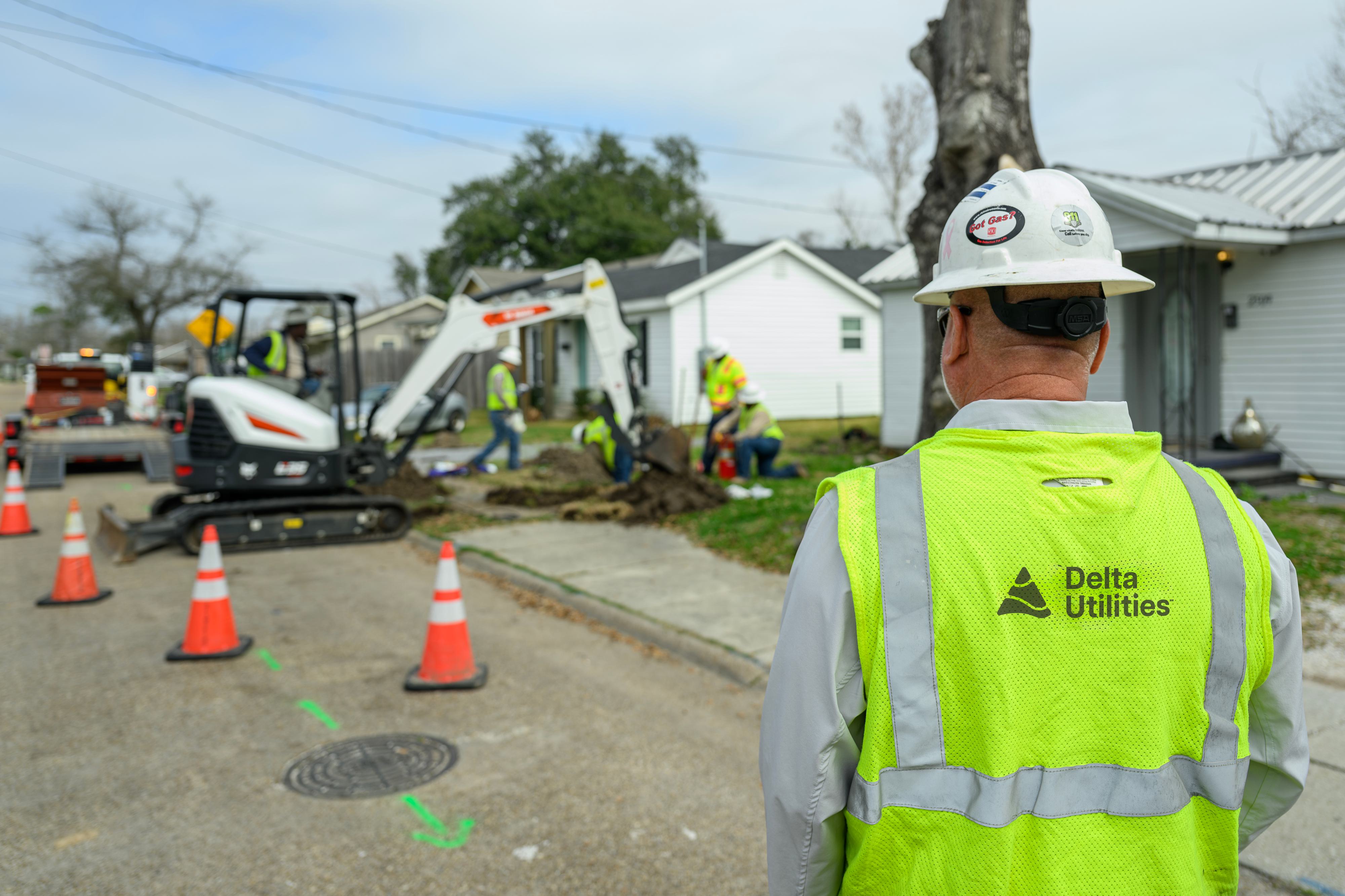 Delta Utilities Workers Digging At A Residential Property To Repair A Delta utilities workers digging at a residential property to repair a