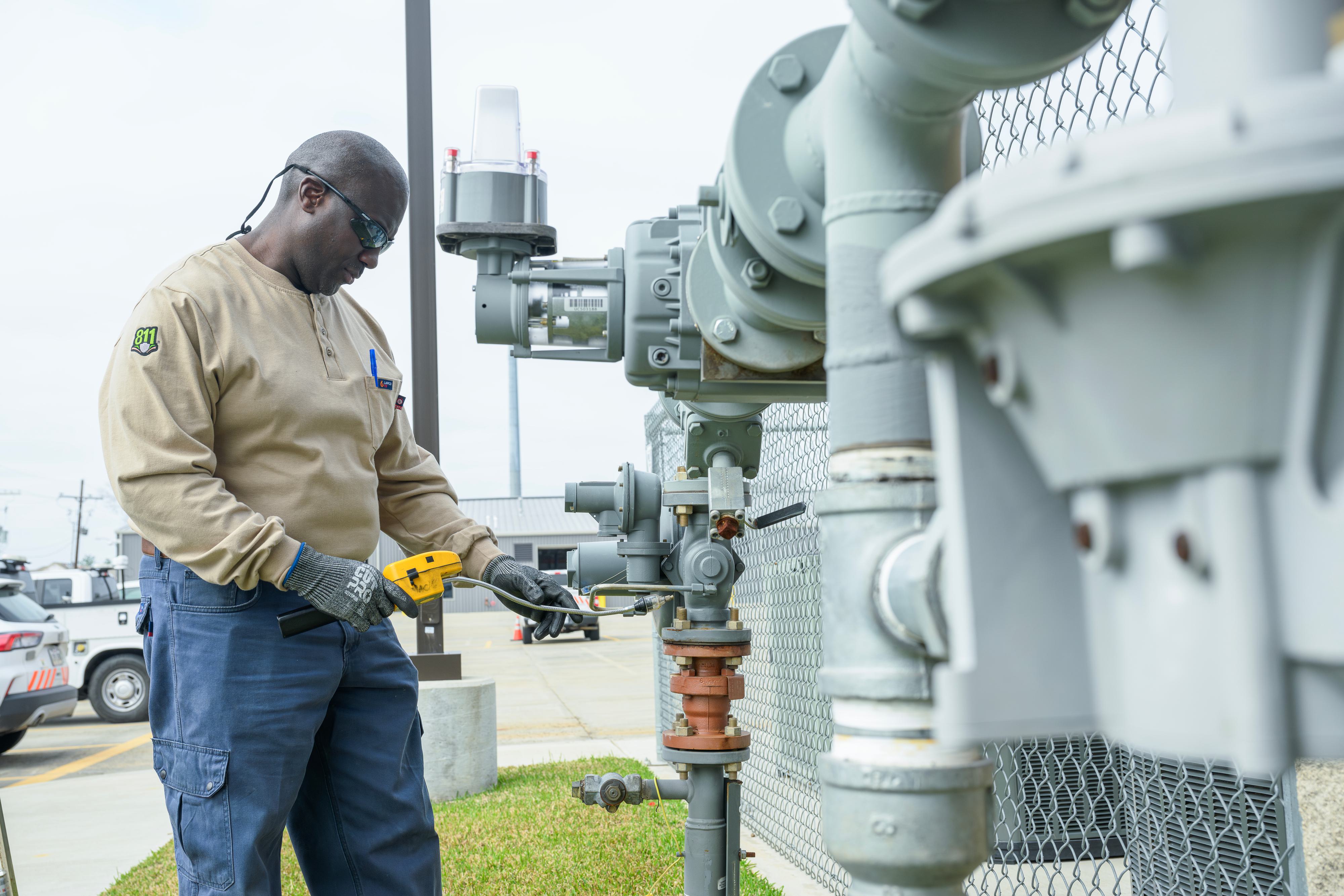 Man working on checking a valve